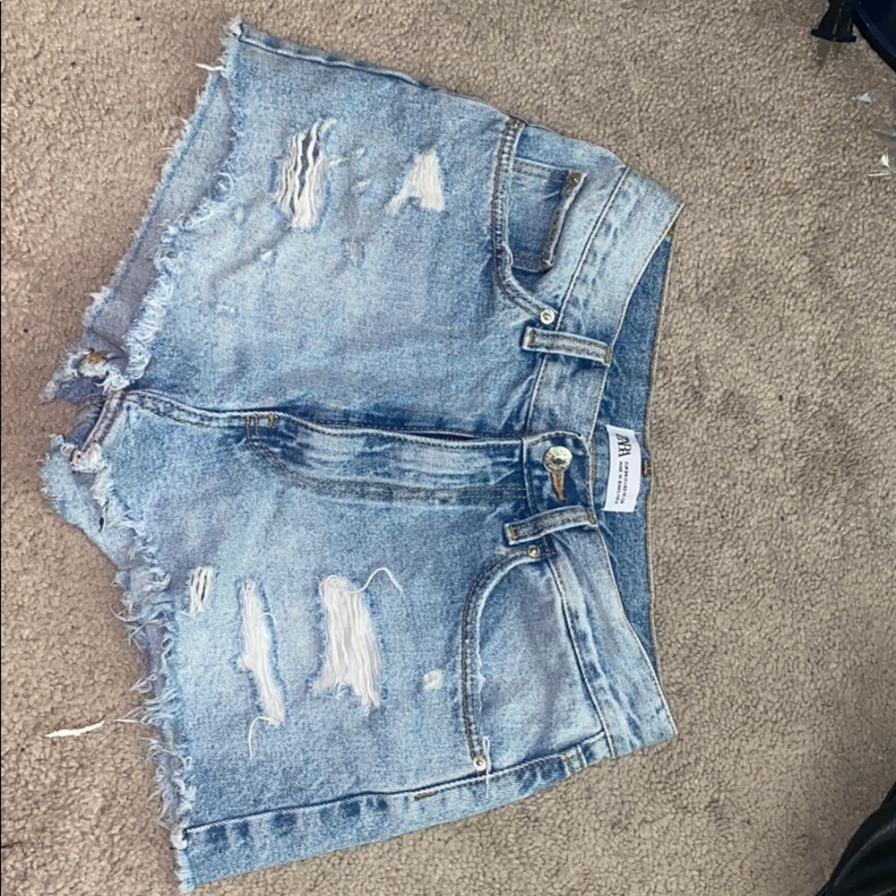 Light wash distressed demon shorts